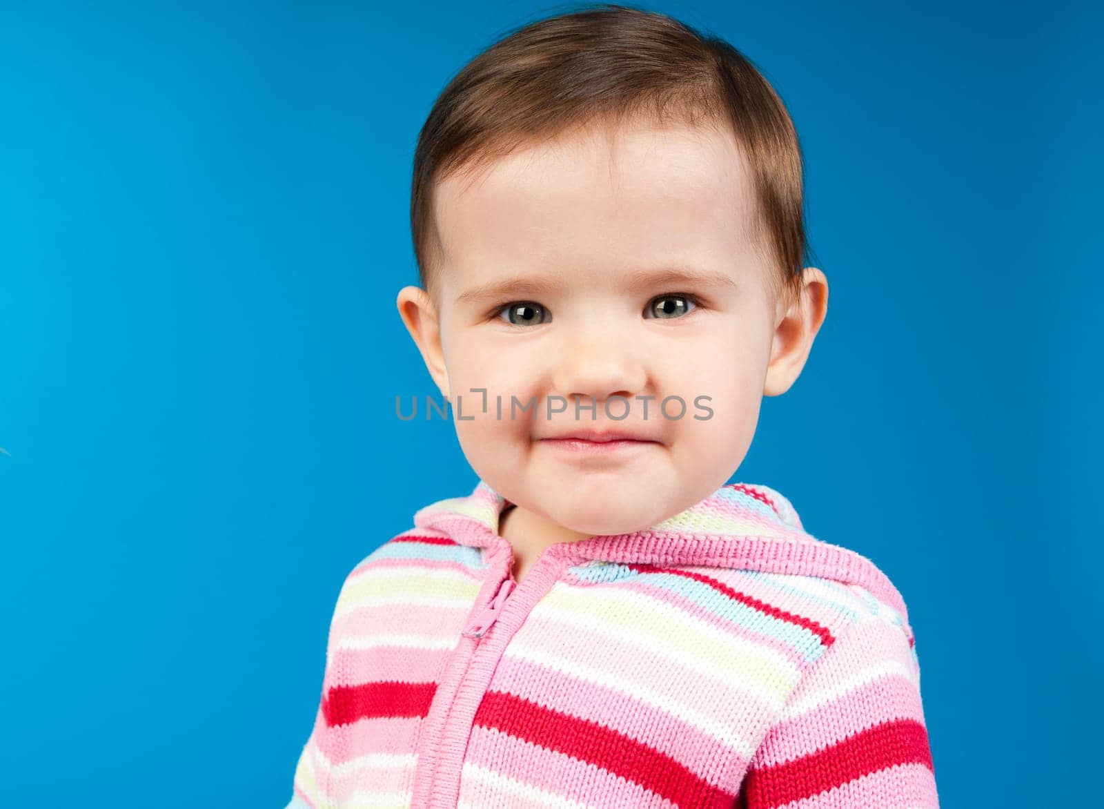 small child isolated on a blue background