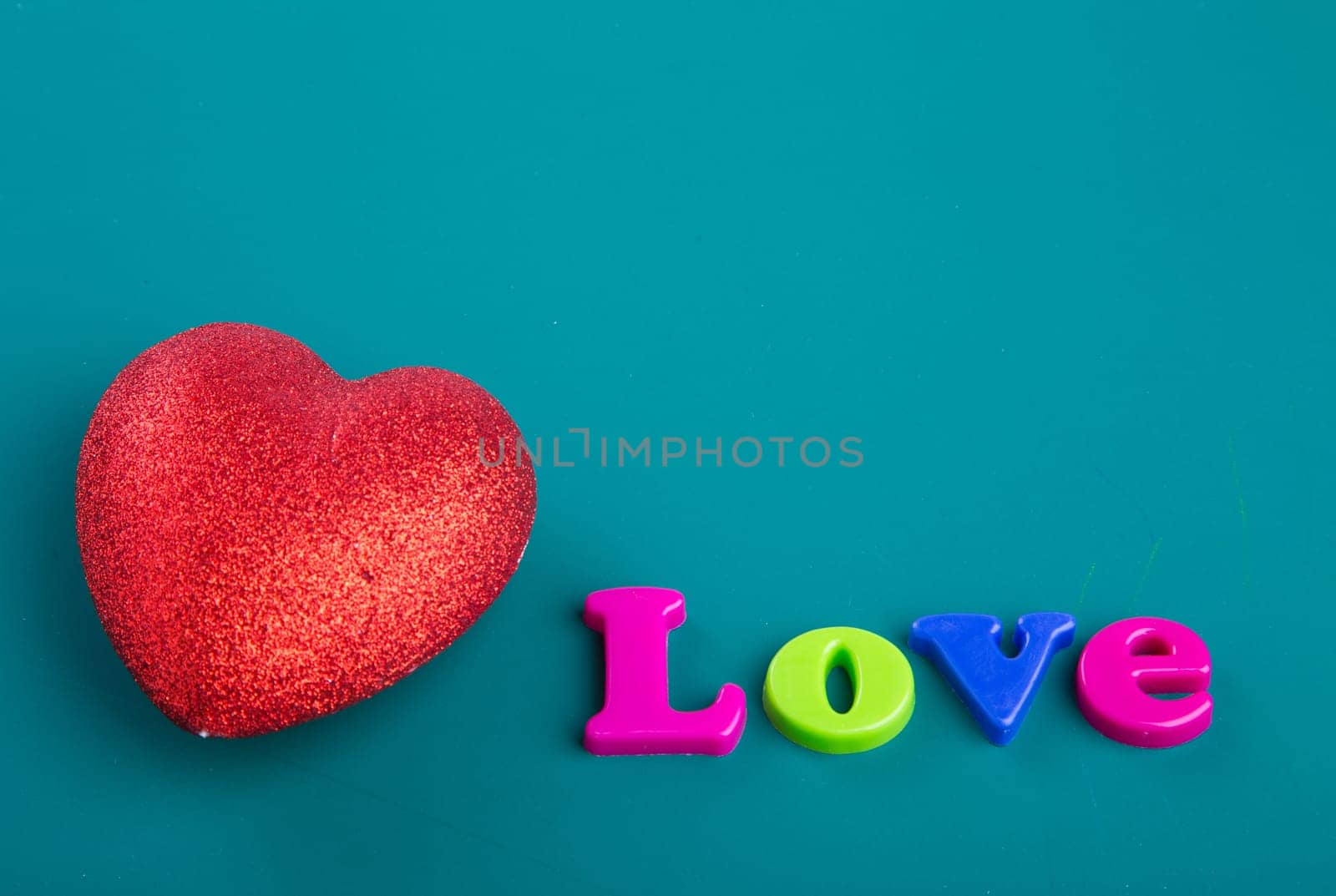 Colorful Alphabet magnetic letters on green background