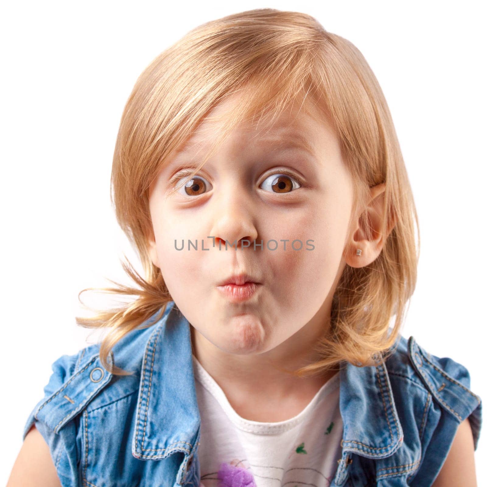 Little cute girl making grimace and having fun