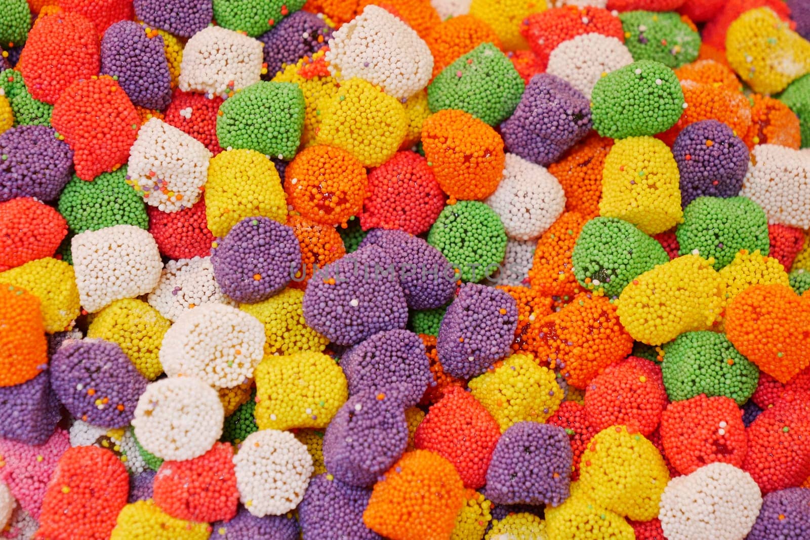 A colorful array of small candy pieces fills the display, inviting delight.