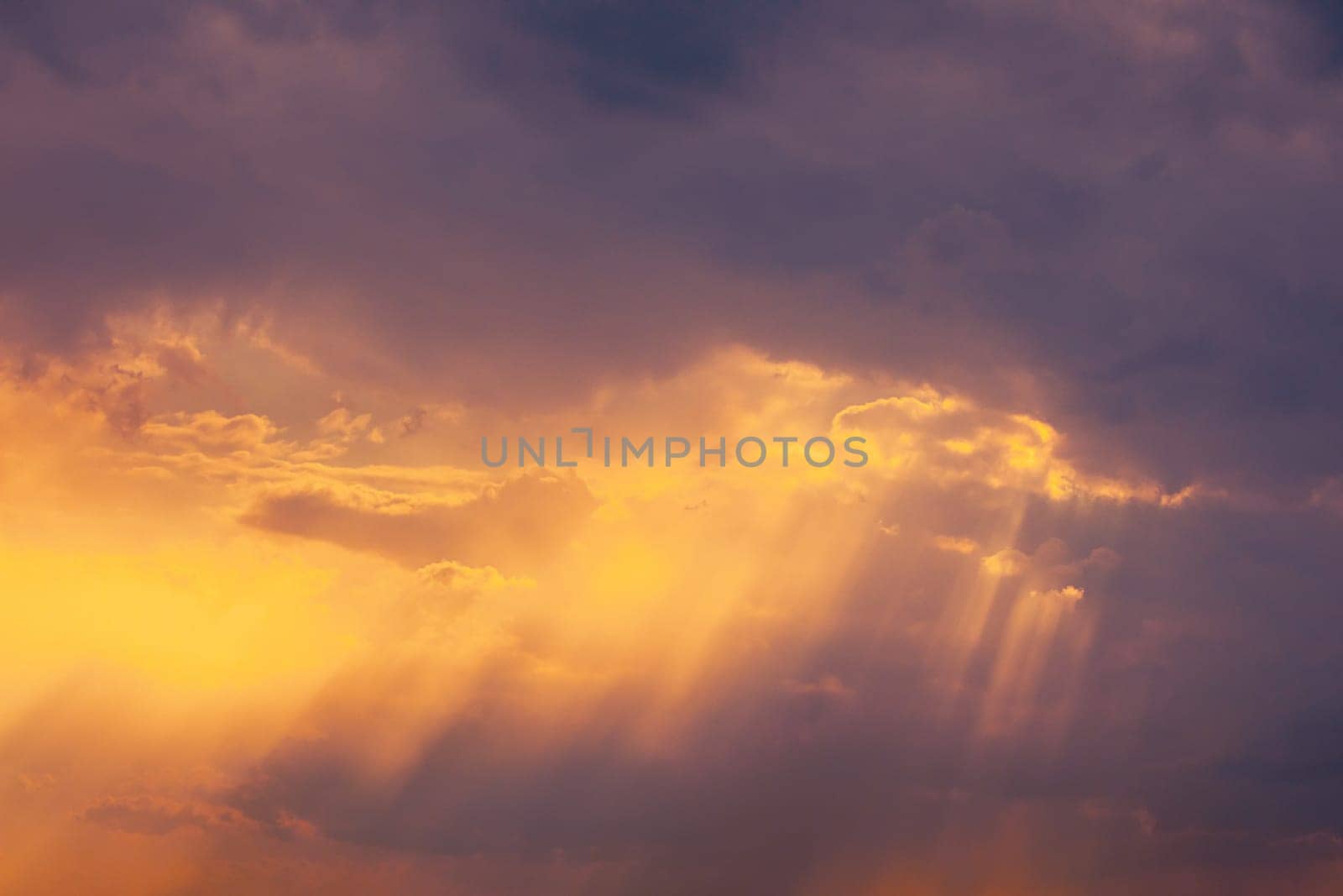 Sunshine In Sunrise Bright Dramatic Sky. Sun Ray Through Dark Rainy Clouds. Scenic Colorful Sky At Dawn. Sunset Sky Natural Abstract Background.