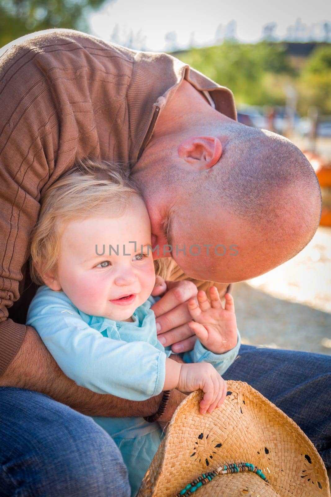 Adorable Young Family Enjoys a Day at the Pumpkin Patch.