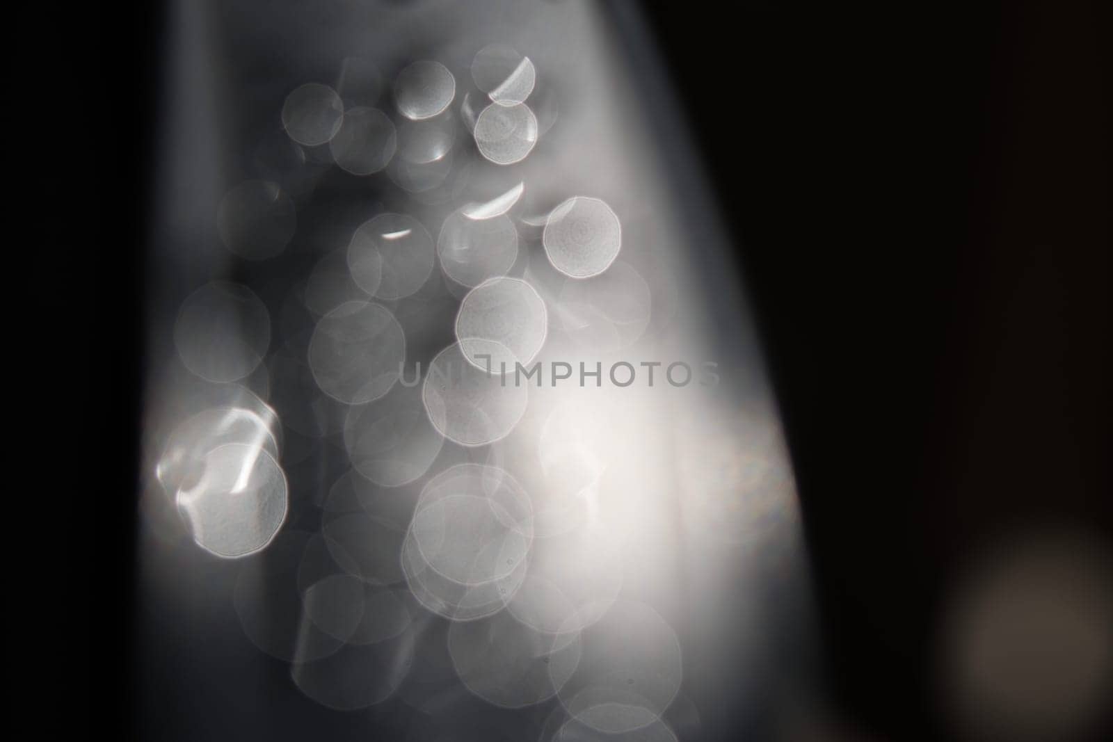 Water drops Abstract and with blurred background shines on a metal surface of a chair. Abstract macro shot