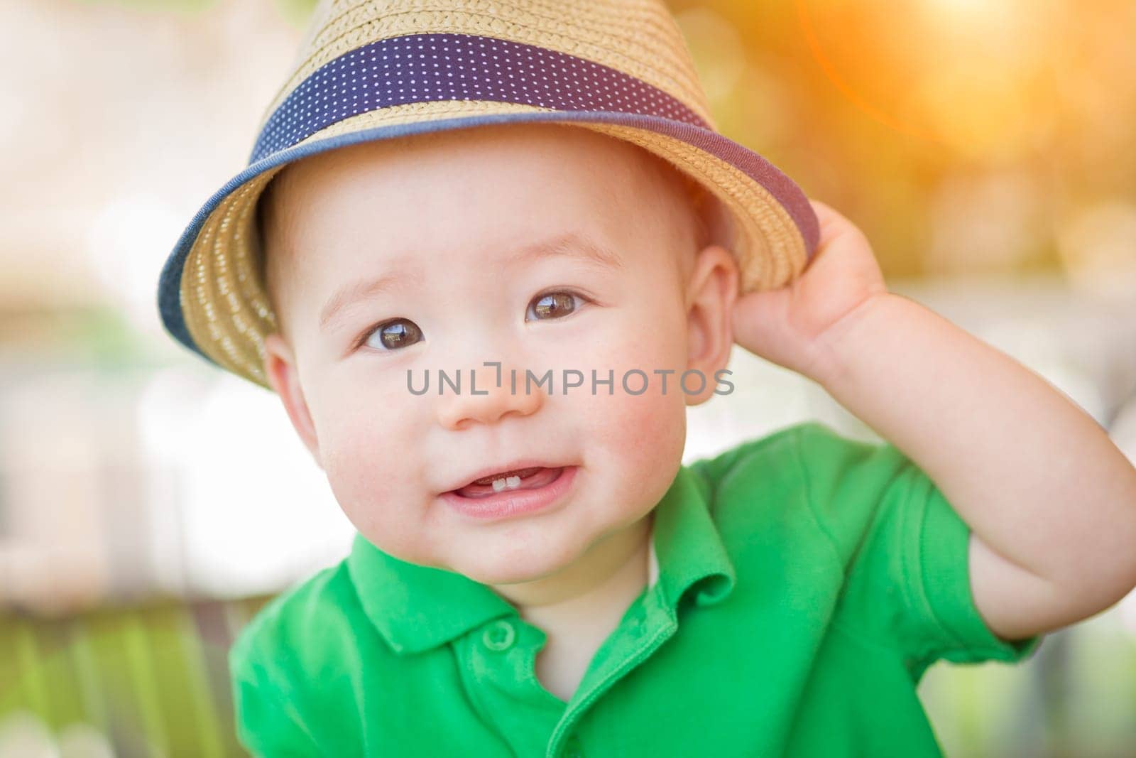 Portrait of A Happy Mixed Race Chinese and Caucasian Baby Boy Wearing His Hat