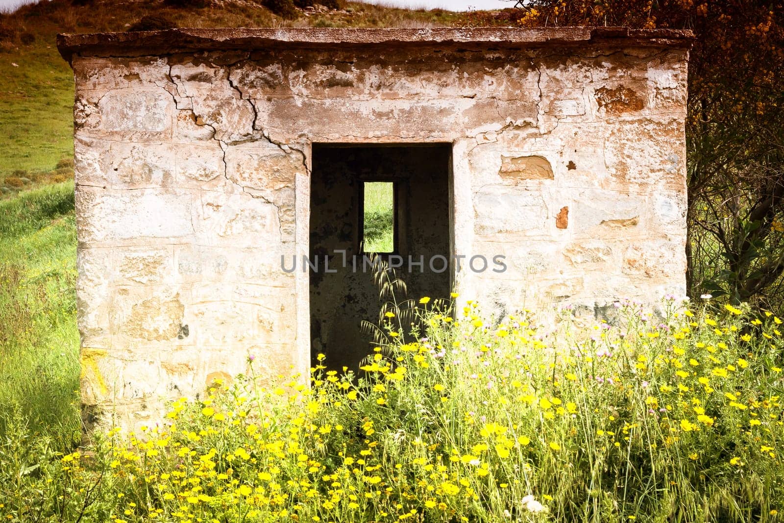 Littlle abandoned house stone in countryside in Sardinia