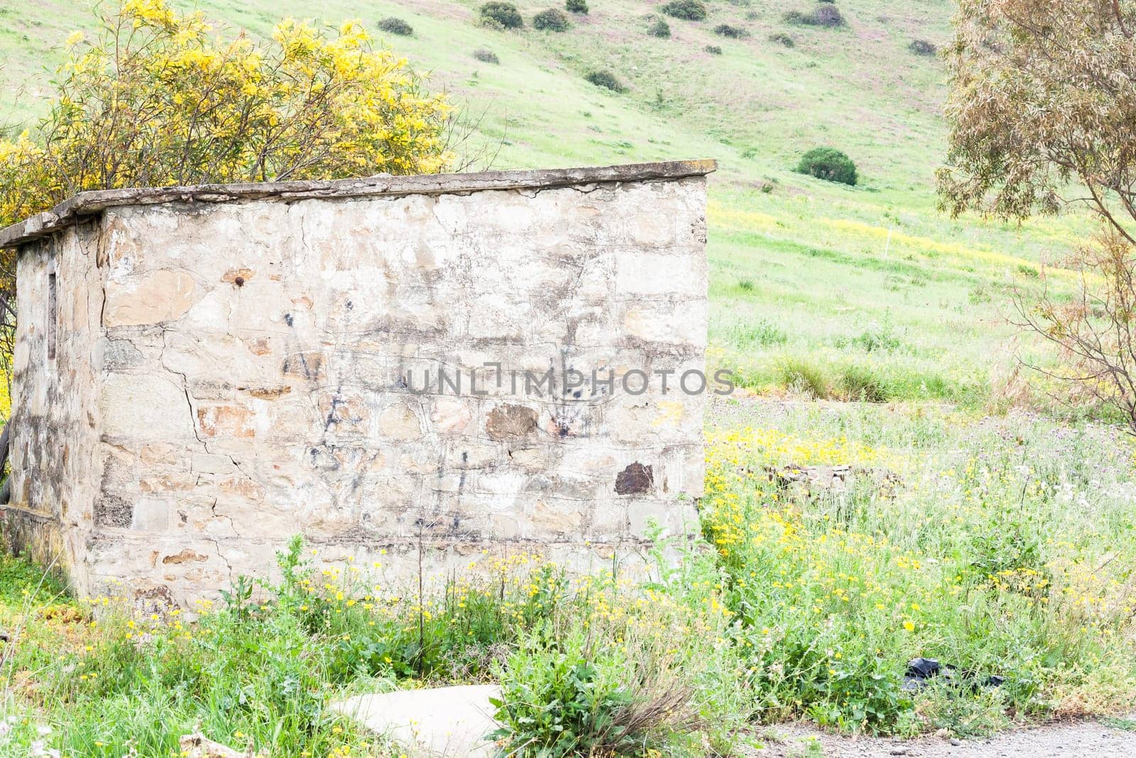 Littlle abandoned house stone in countryside in Sardinia