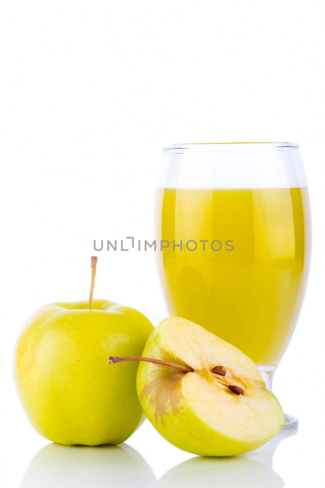 Apple juice in glass and green apples. Isolated on white background