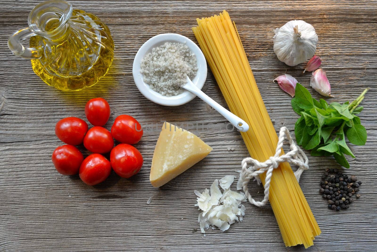 Pasta Tomatoes Parmesan on wood background