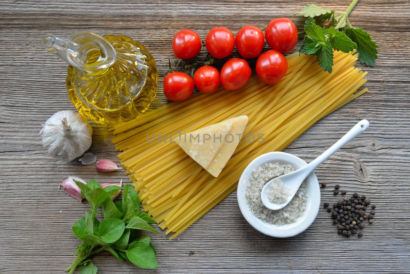 Pasta Tomatoes Parmesan on wood background