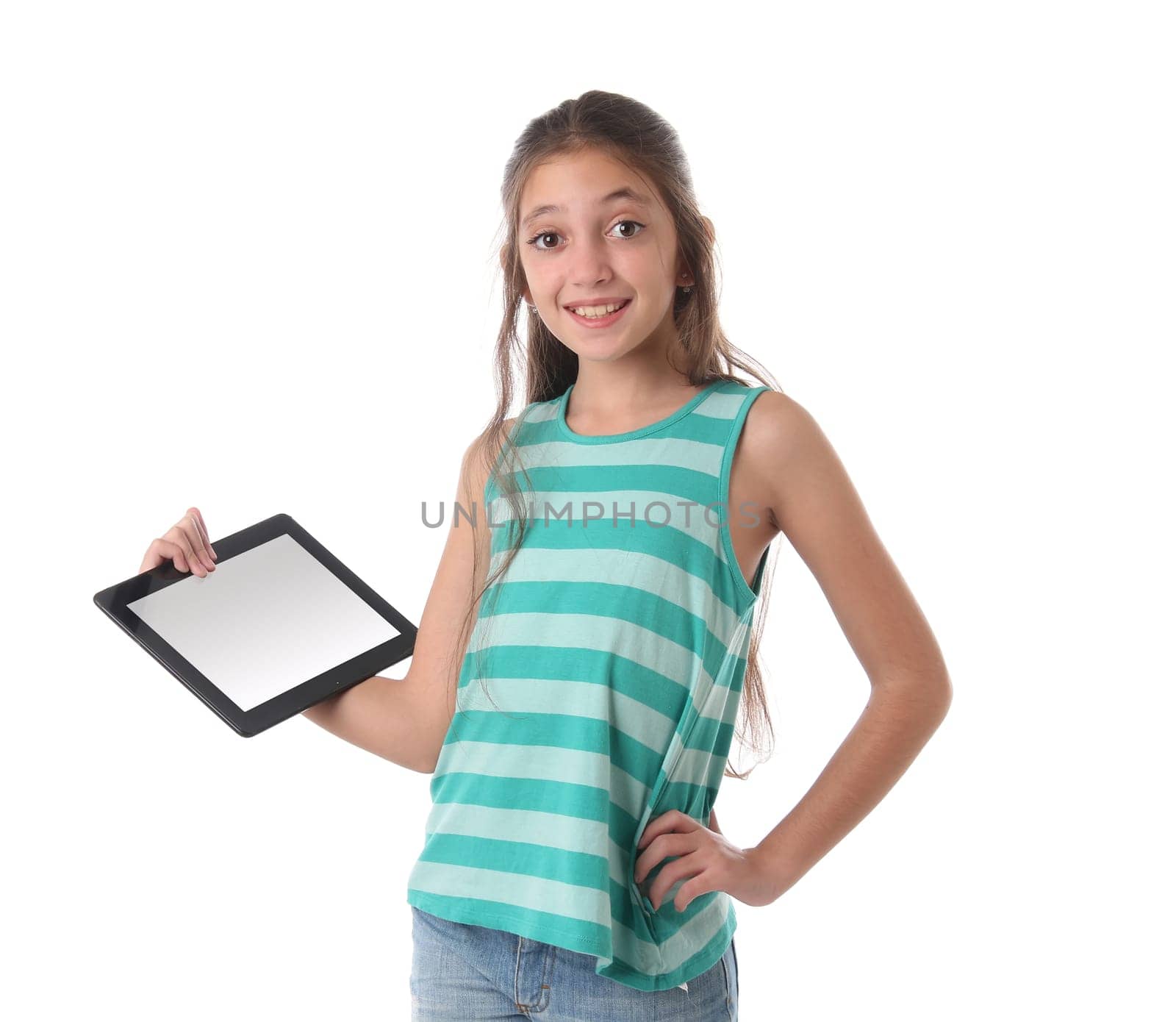 Beautiful pre-teen girl with a tablet computer. Isolated. Clipping path for the screen