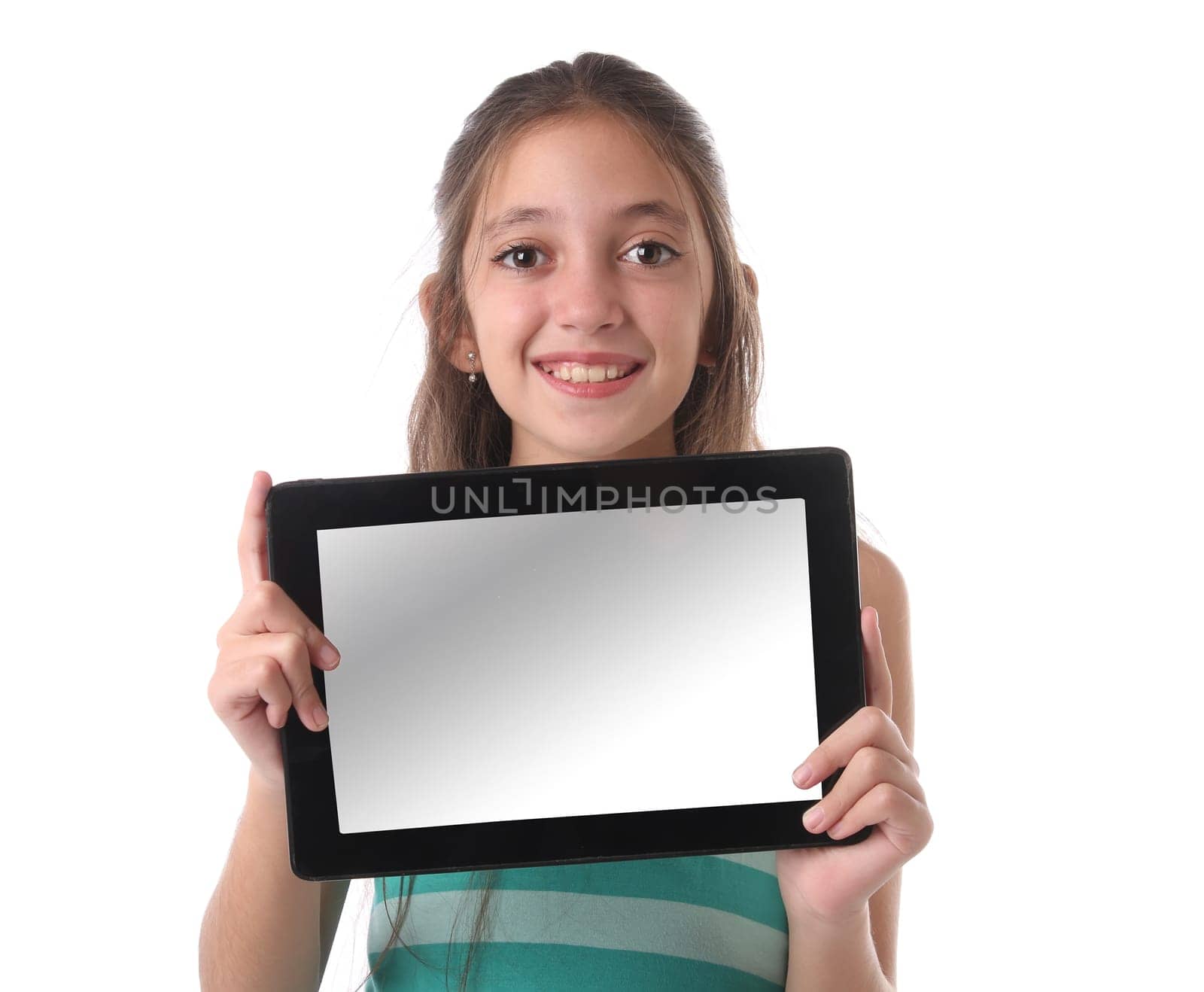 Beautiful pre-teen girl with a tablet computer. Isolated. Clipping path for the screen