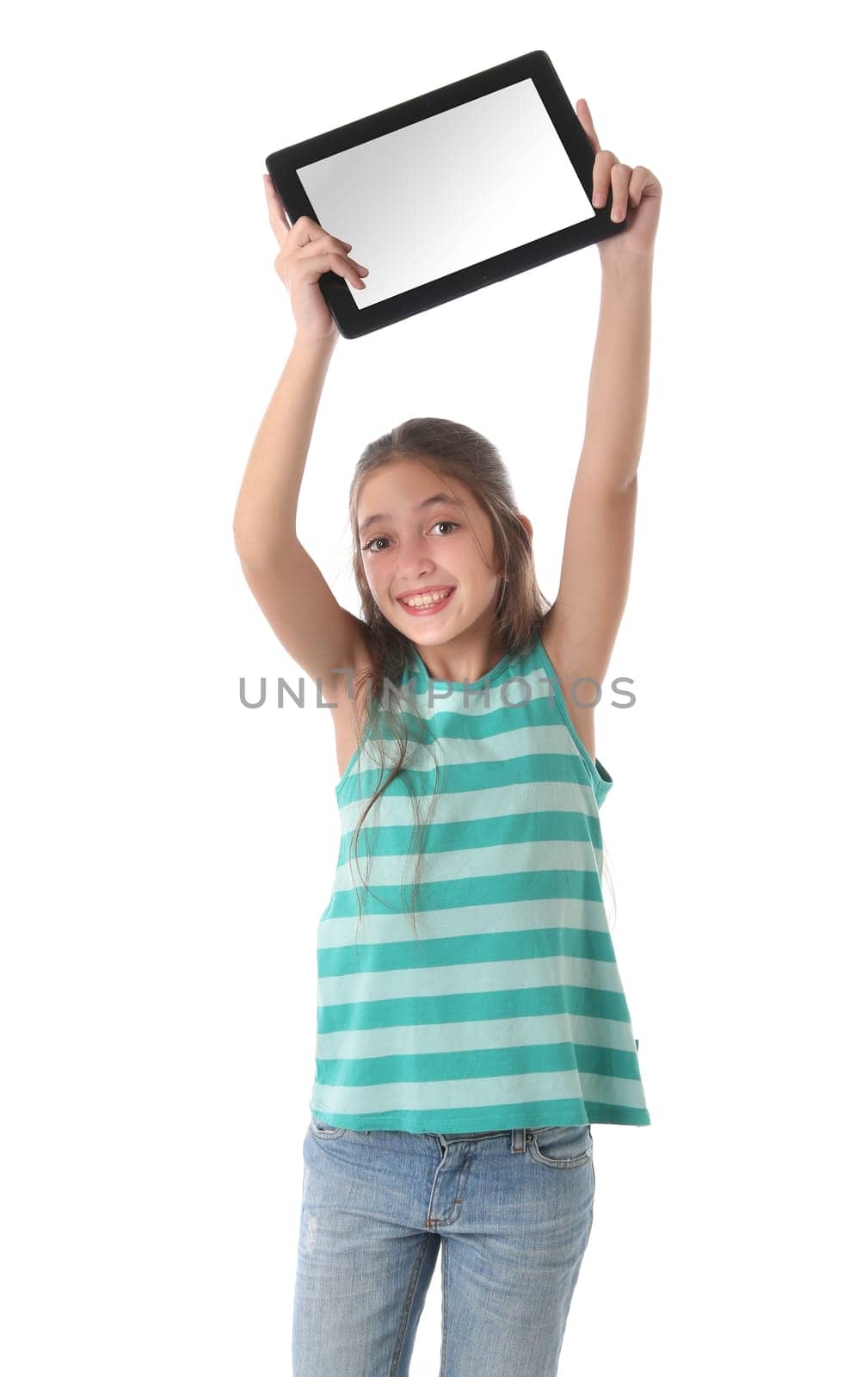 Beautiful pre-teen girl with a tablet computer. Isolated. Clipping path for the screen