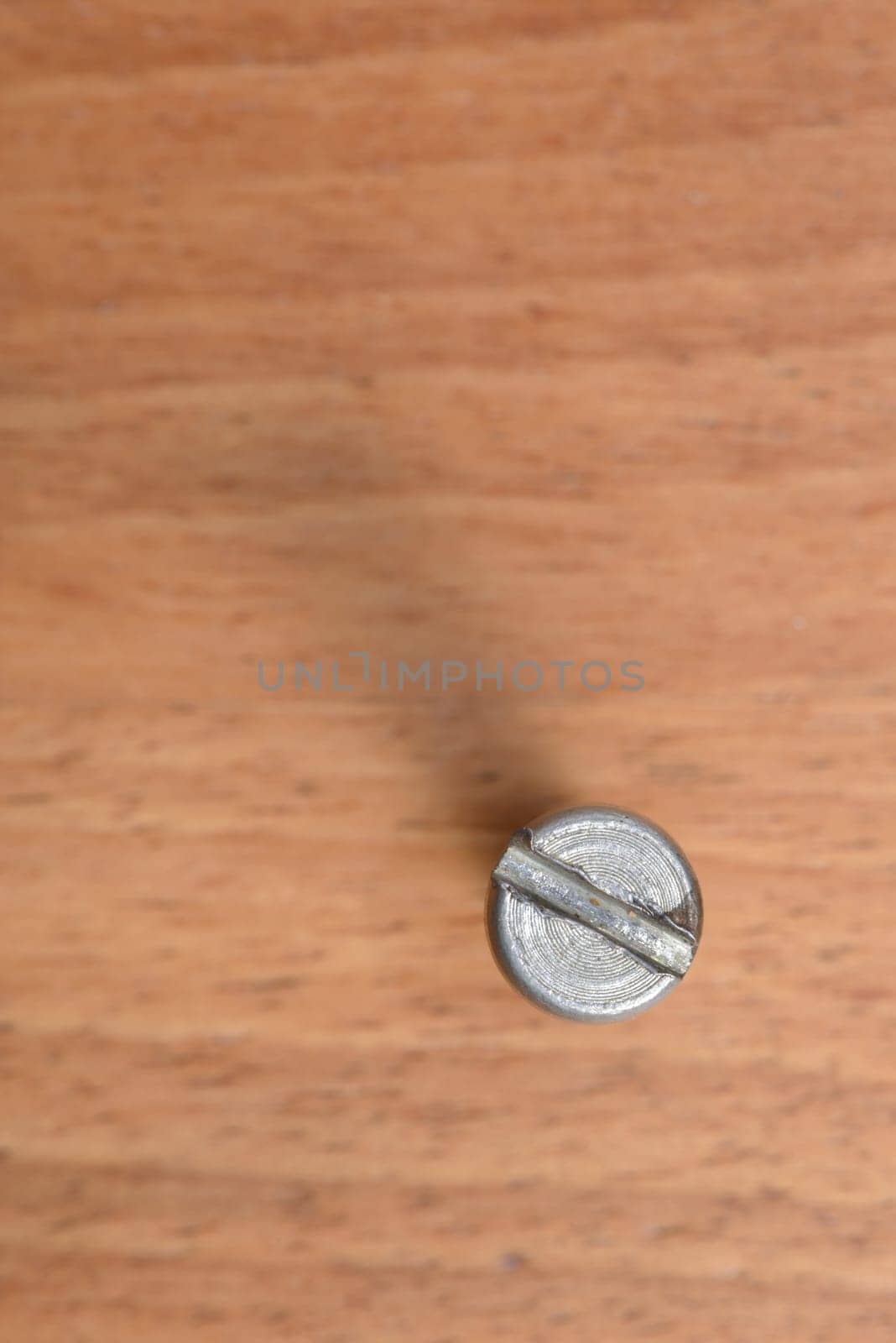 One bolt on wood blur background