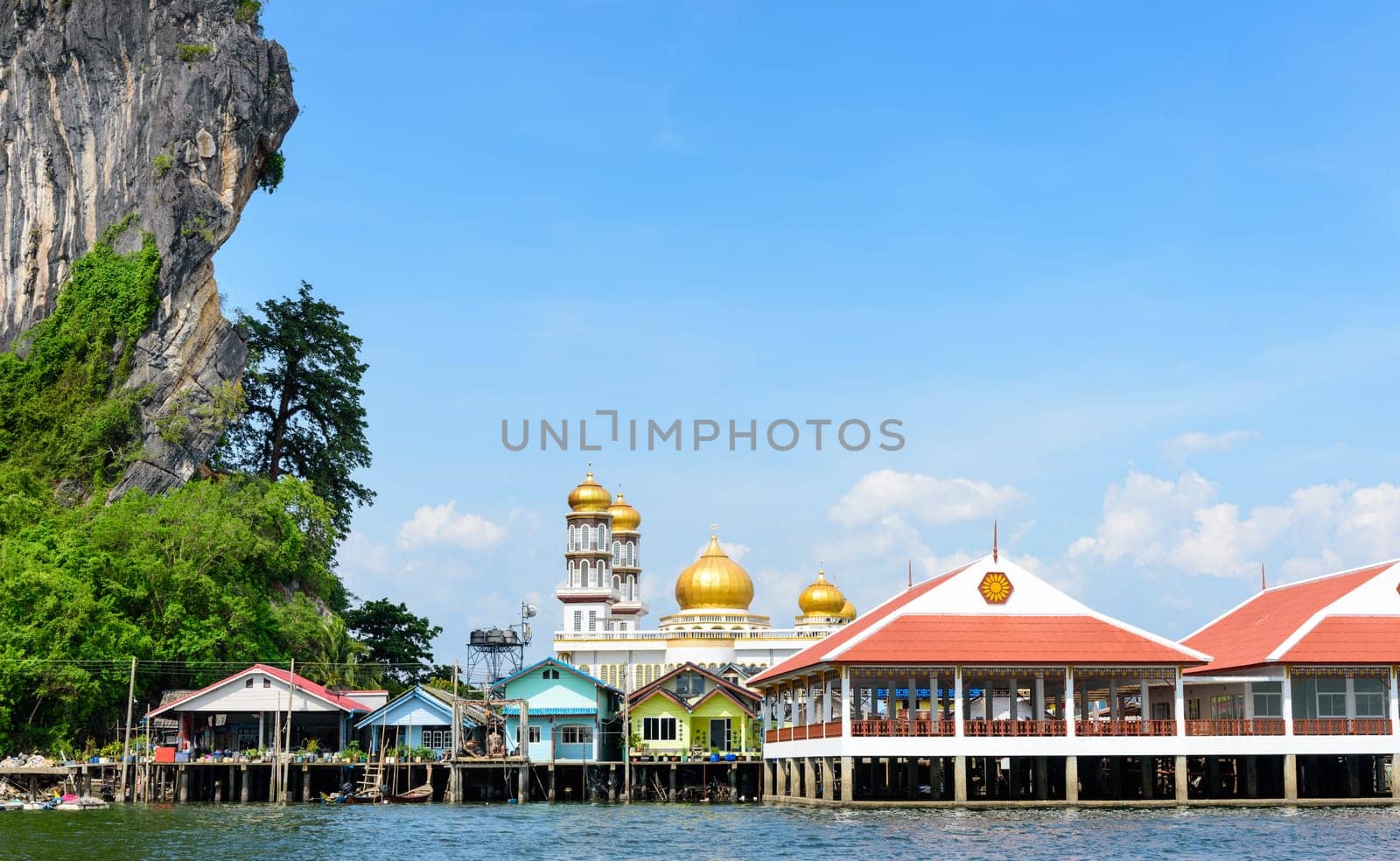 Beautiful landscape sea and blue sky in summer at Punyi Island or Koh Panyee is fisherman village cultural attractions travel by boat in Phang Nga Bay or Ao Phang Nga National Park, Thailand, 16:9 Widescreen