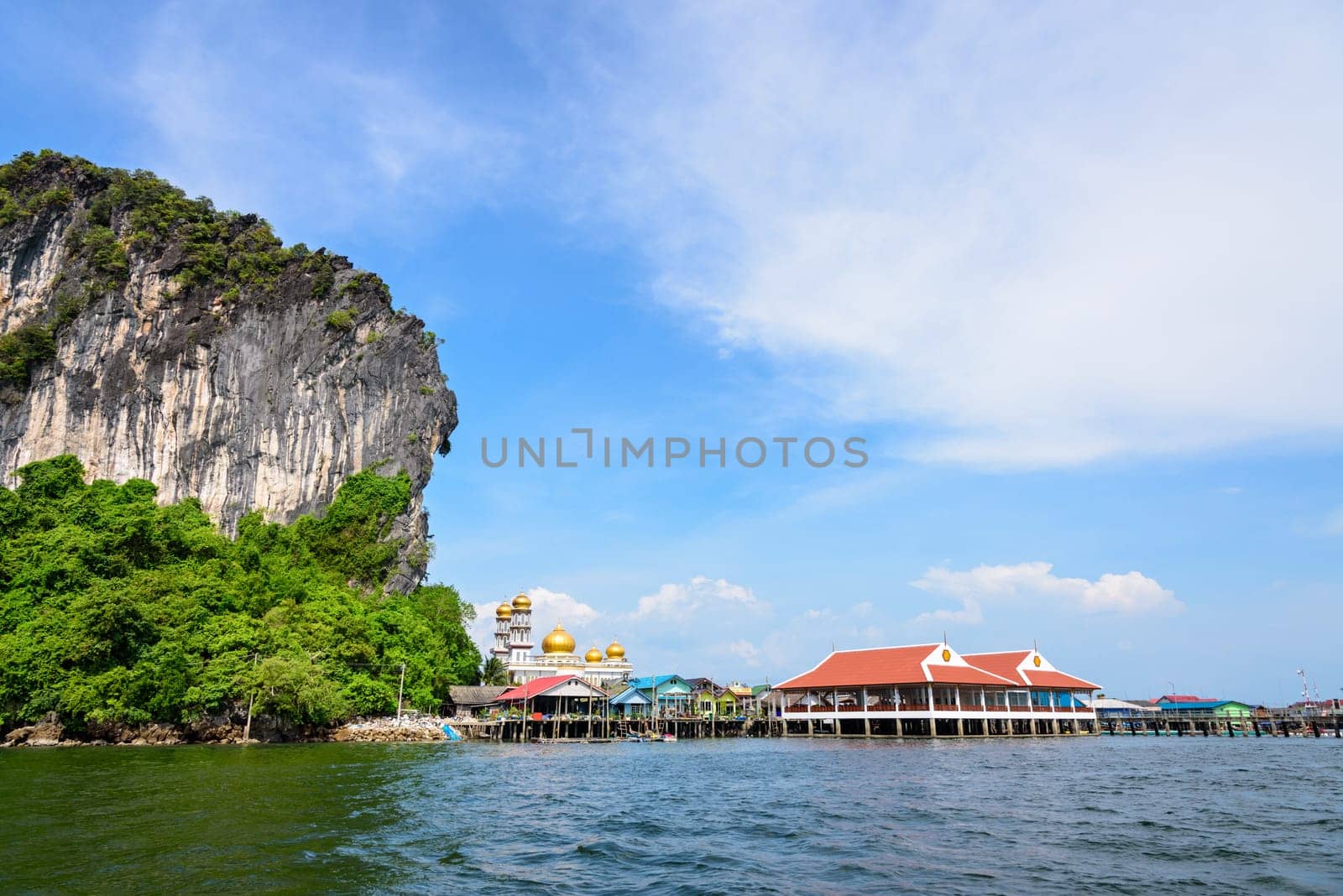 Beautiful landscape sea and blue sky in summer at Punyi Island or Koh Panyee is fisherman village cultural attractions travel by boat in Phang Nga Bay or Ao Phang Nga National Park, Thailand