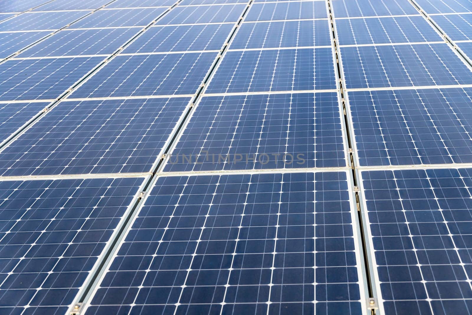 Photovoltaic panels on the roof . Roof Of Solar Panels. View of solar panels (solar cell) in the roof house with sunlight