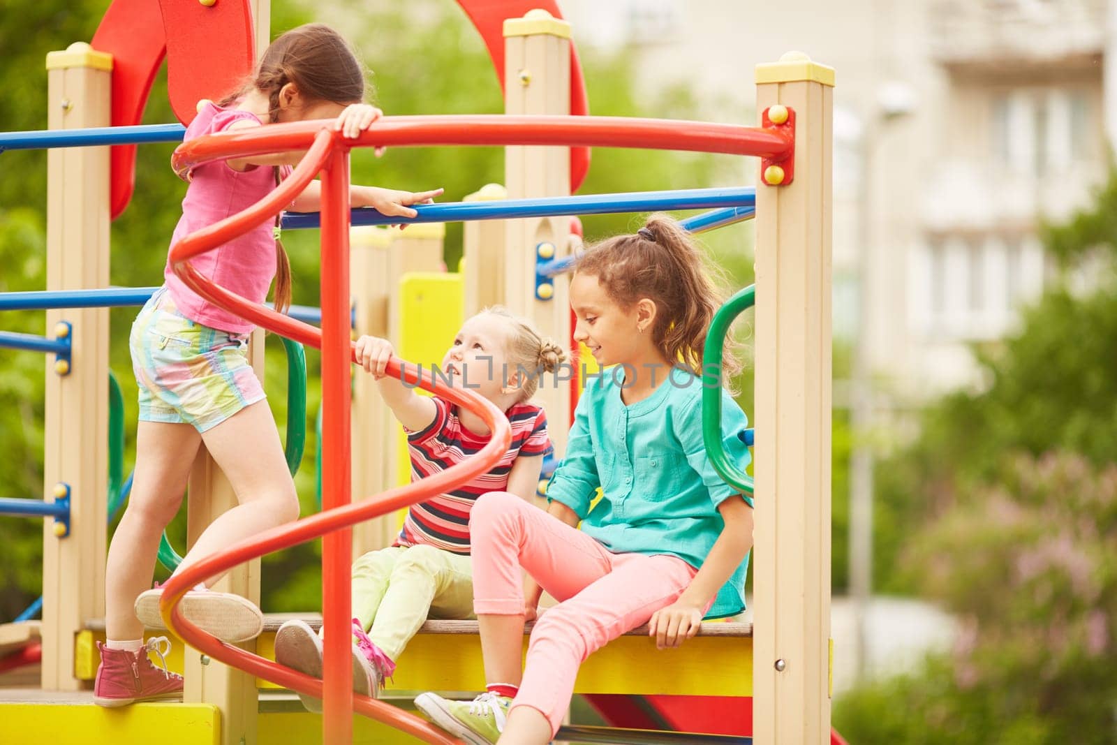 Friendly girls spending weekend on playground