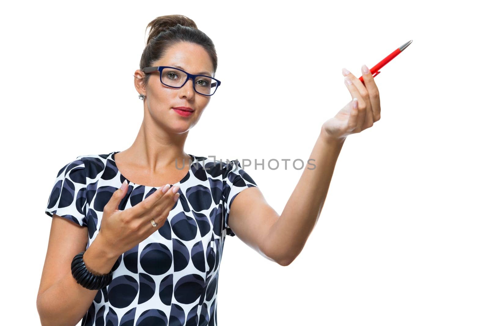attractive businesswoman shows with a ballpoint pen up insulated against a white background with text freedom
