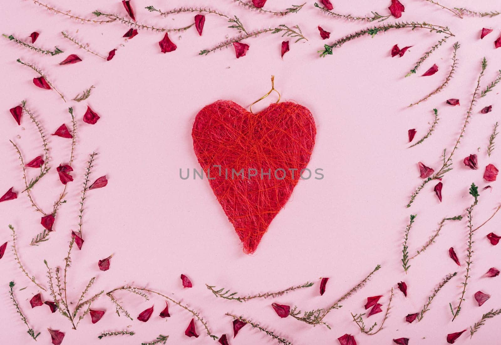 Valentine's day background design. Top view of valentine heart and flowers pattern over pink background.