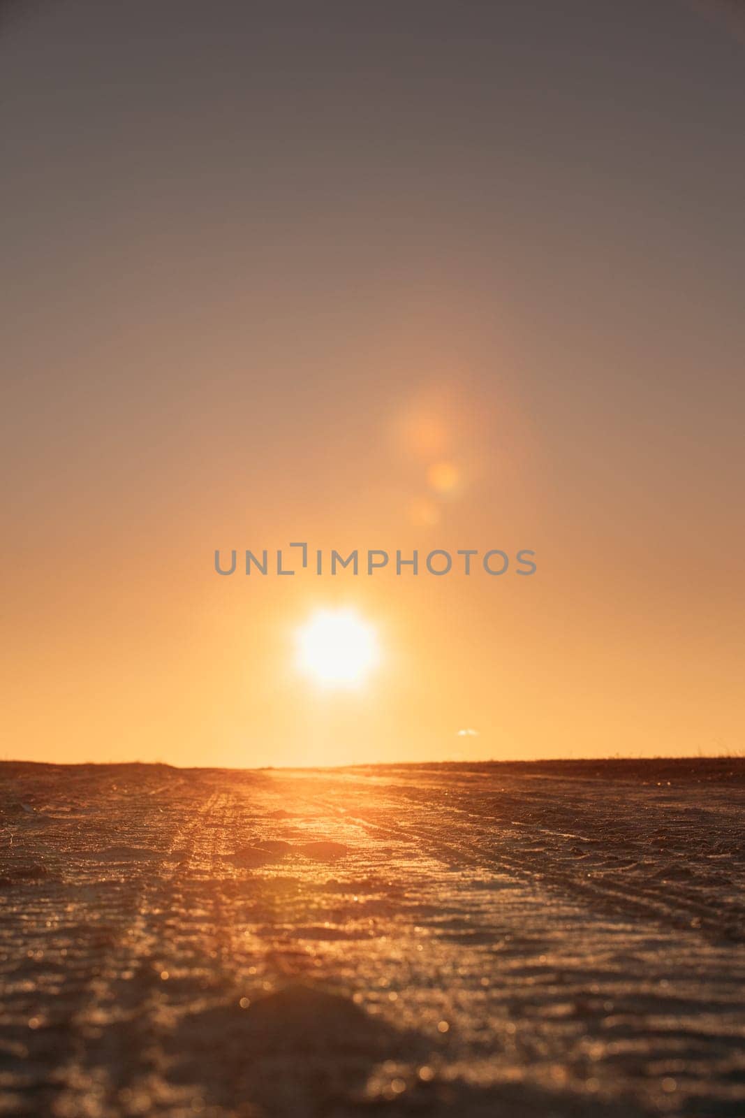 Sun Shine Above Countryside Sandy Country Road In Sunny Sunrise Morning. Open Road In Sunny Sunset Evening.