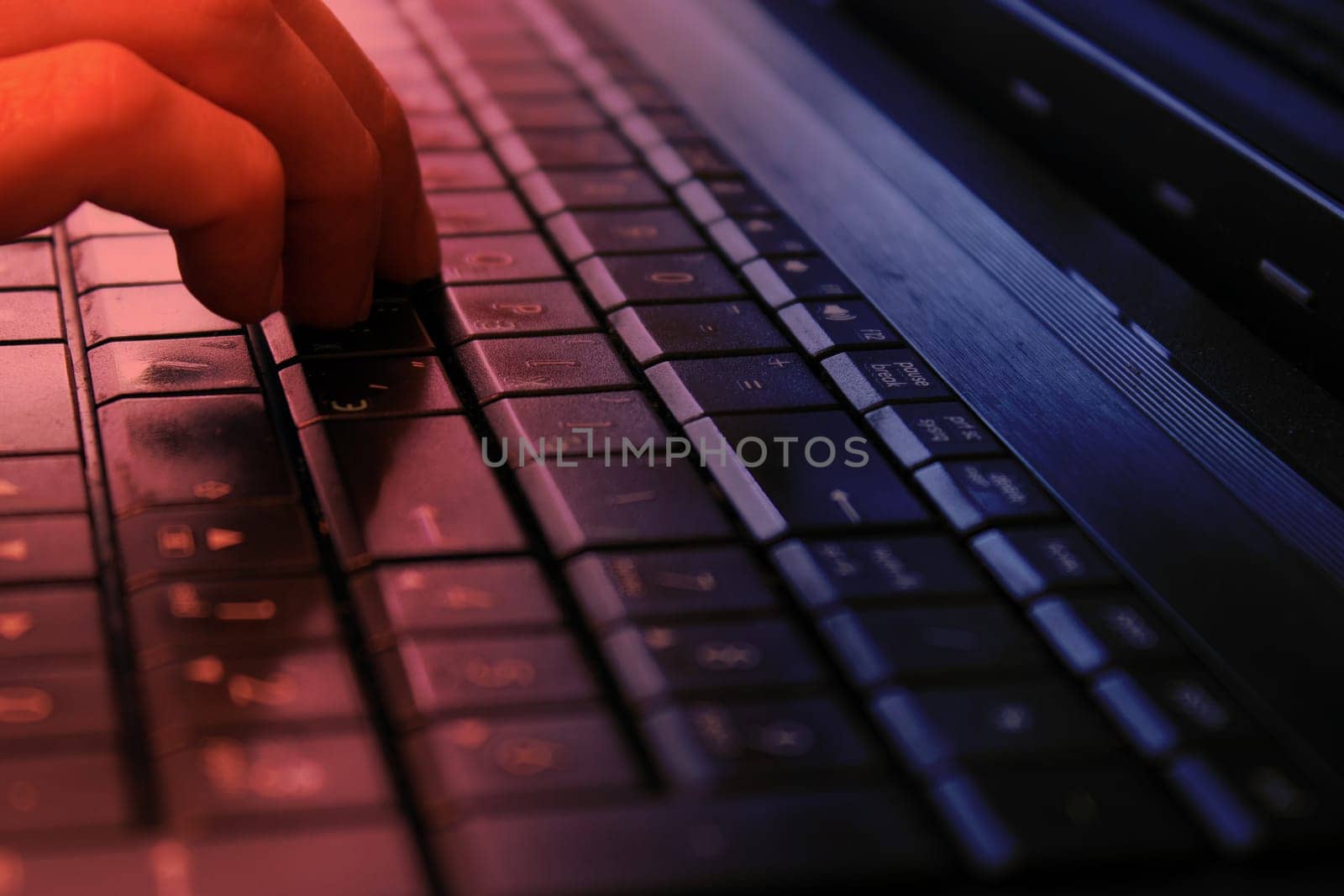 Hand on the keyboard with Russian layout. The concept of information protection, cyber attacks. The concept of work from home, business, online shopping.