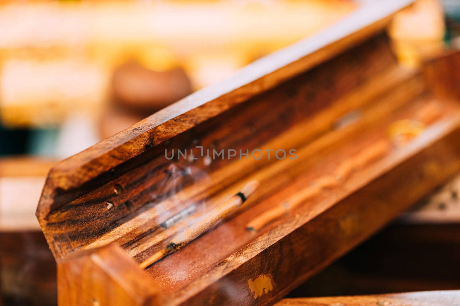 Smoking Burning Incense Aromatic Sticks In Wooden Box Releases Fragrant Smoke. Incense Is Used For Aesthetic Reasons, Aromatherapy, Meditation, And Ceremony.