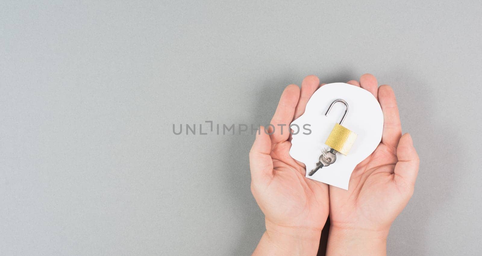 Silhouette of a head with an open lock, free mind, uncontrolled thoughts, freedom of speech concept