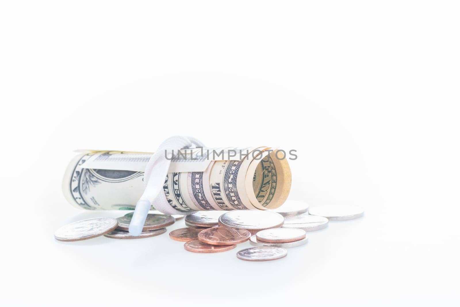 Shoestring budget concept with US dollars and coins