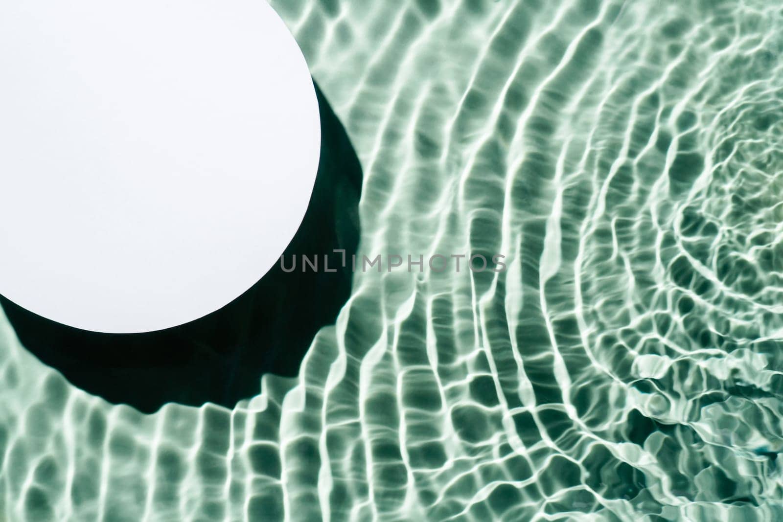 White circle copy space in transparent fresh green blue water drop splashing gel surface with flecks, waves, shade. Health care relaxation. Vacation coast sea natural concept. Flat lay. Place for text