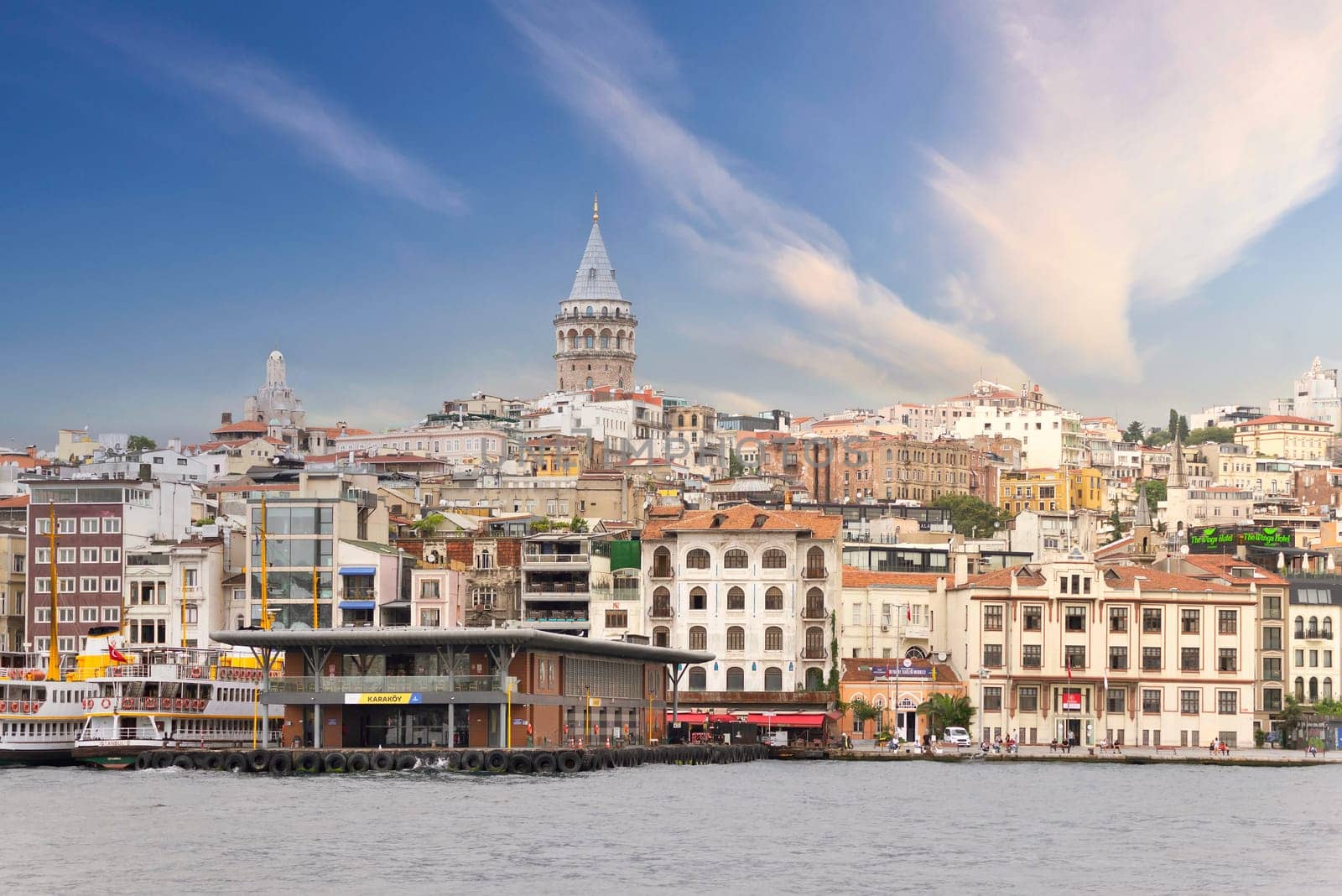 Istanbul, Turkey - August 25, 2022: City view of Istanbul skyline, from the Bosporous strait overlooking Galata Tower, Karakoy ferry terminal, and Istanbul Regional Port Authority