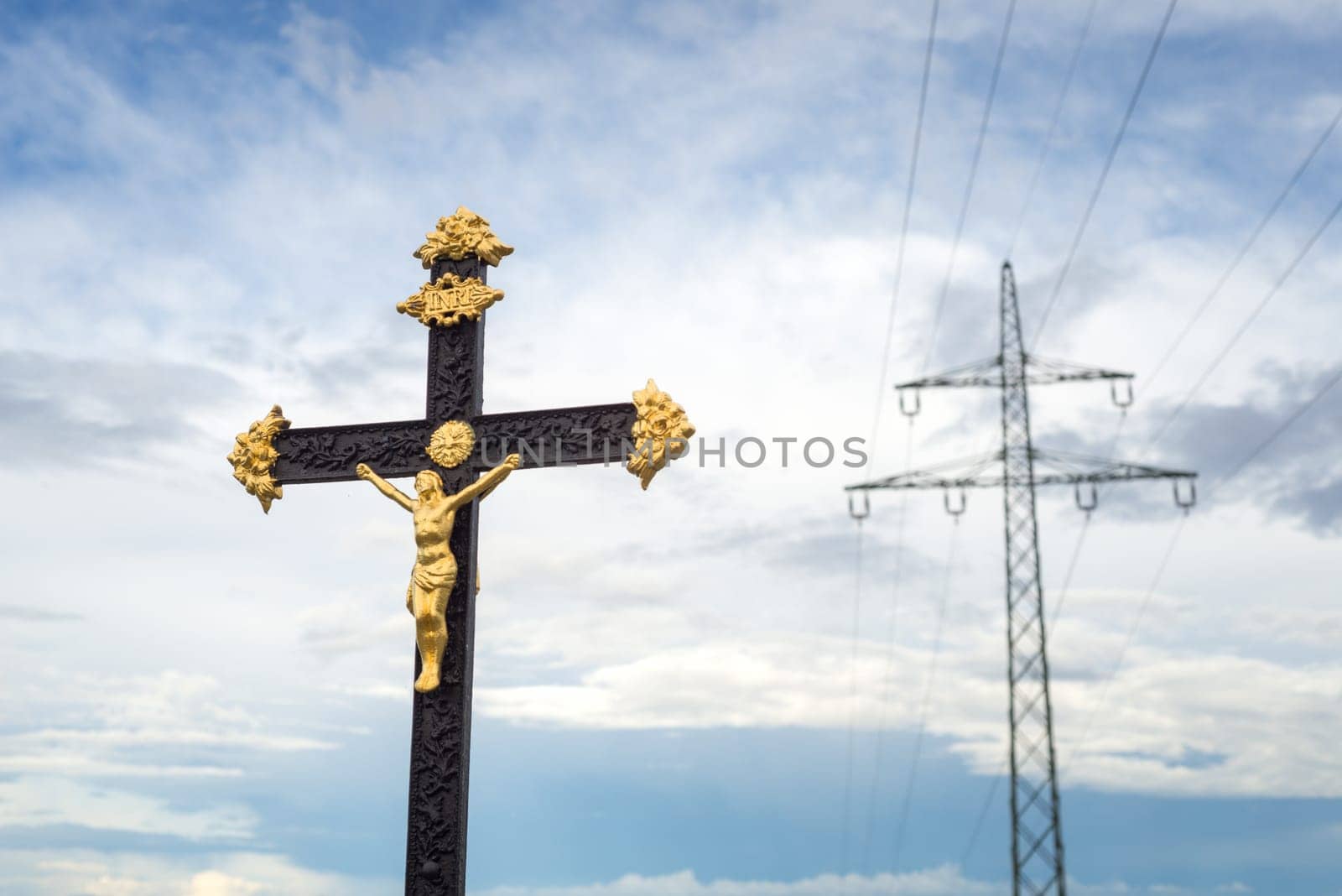 Sculpture Of Jesus Christ with electricity pylon