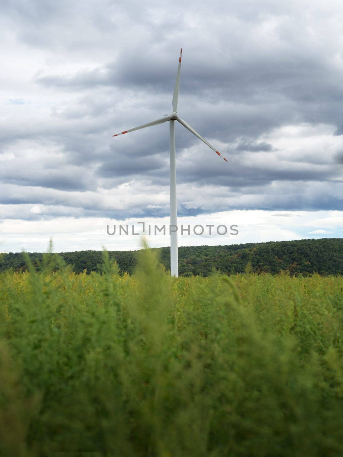 clean electricity producing wind turbines built on a windy mountain ridge