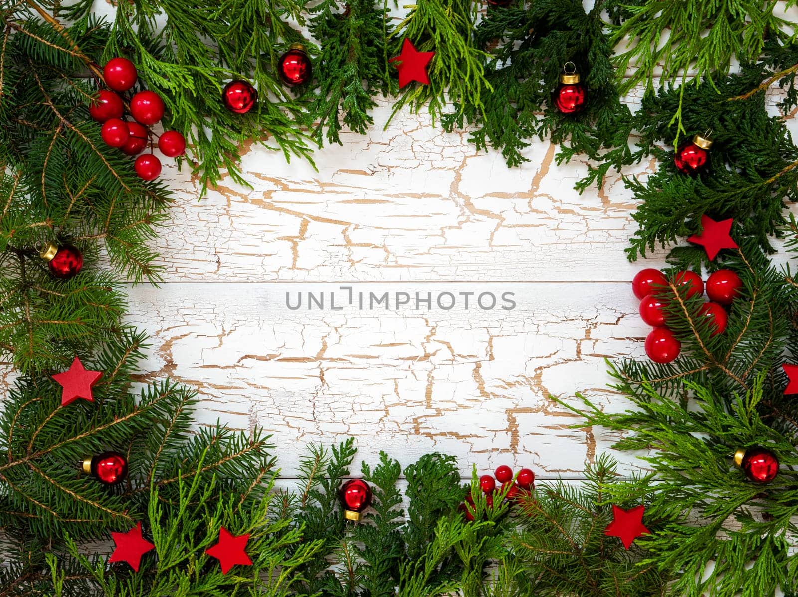 Christmas Card With Fir Branches And Copy Space For Your Text. White Wooden Background With Vintage Design And Christmas Decoration Like Red Ornament Balls.