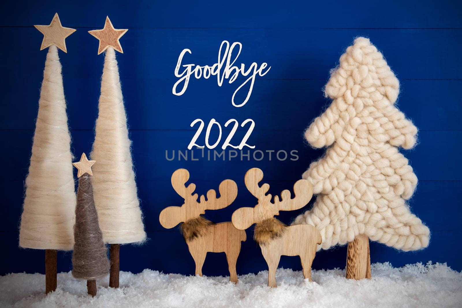 English Calligraphy Goodby 2022 On Blue Background With Snow. Decoration And Ornament Like Christmas Trees And A Moose Couple.