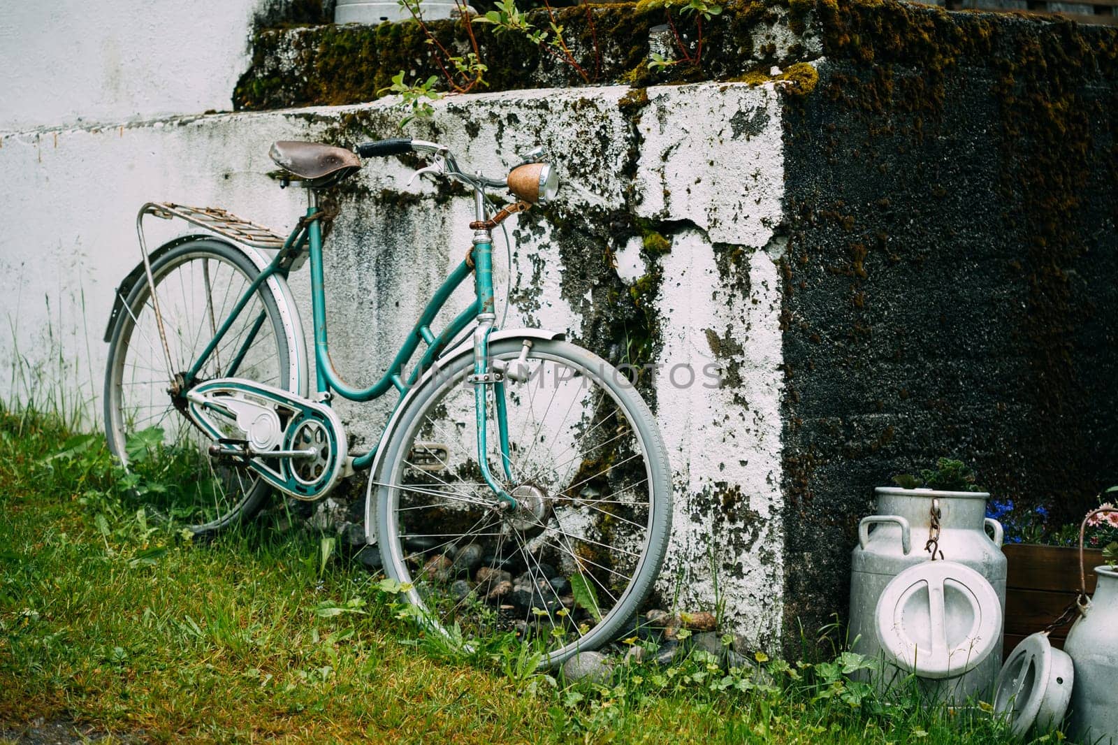 Old Rarity Bicycle Parked Next To Old Wall In Village.