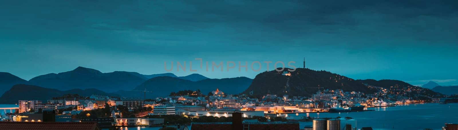 Alesund, Norway. Night Alesund Skyline Cityscape. Historical Center In Summer Evening. Famous Norwegian Landmark And Popular Destination. Alesund, Kiven viewpoint, Mt. Panorama Panoramic View