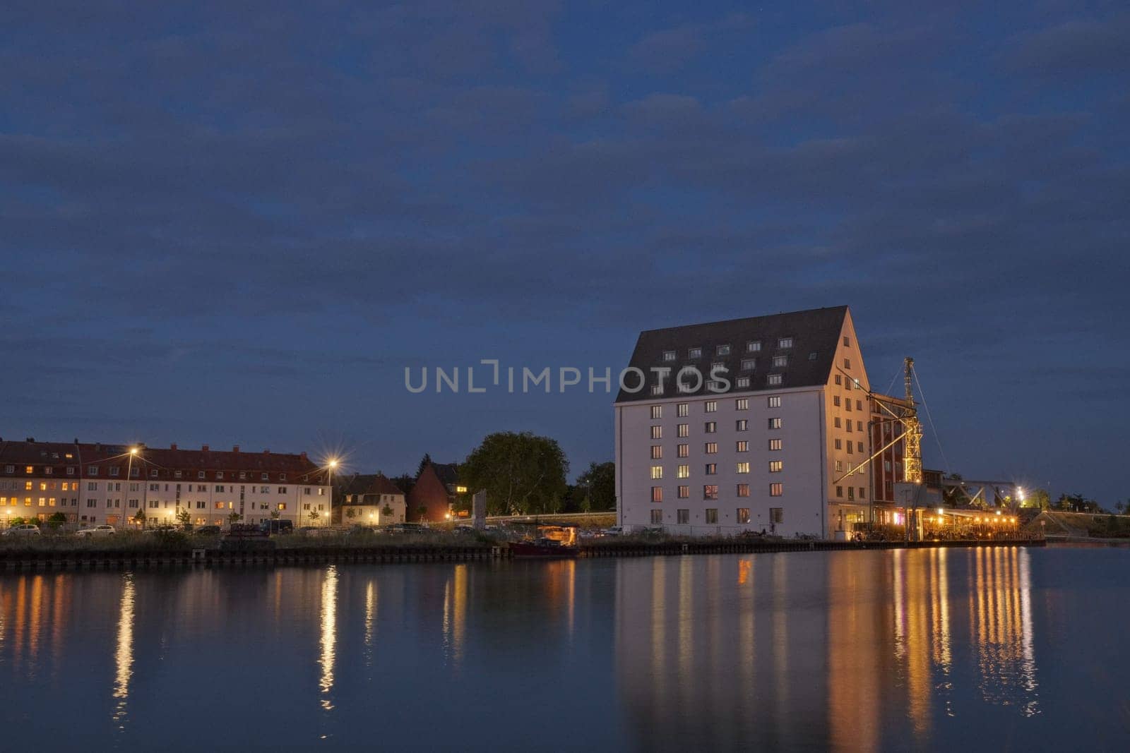 House illuminated at sunset in the harbor of Munster, Germany