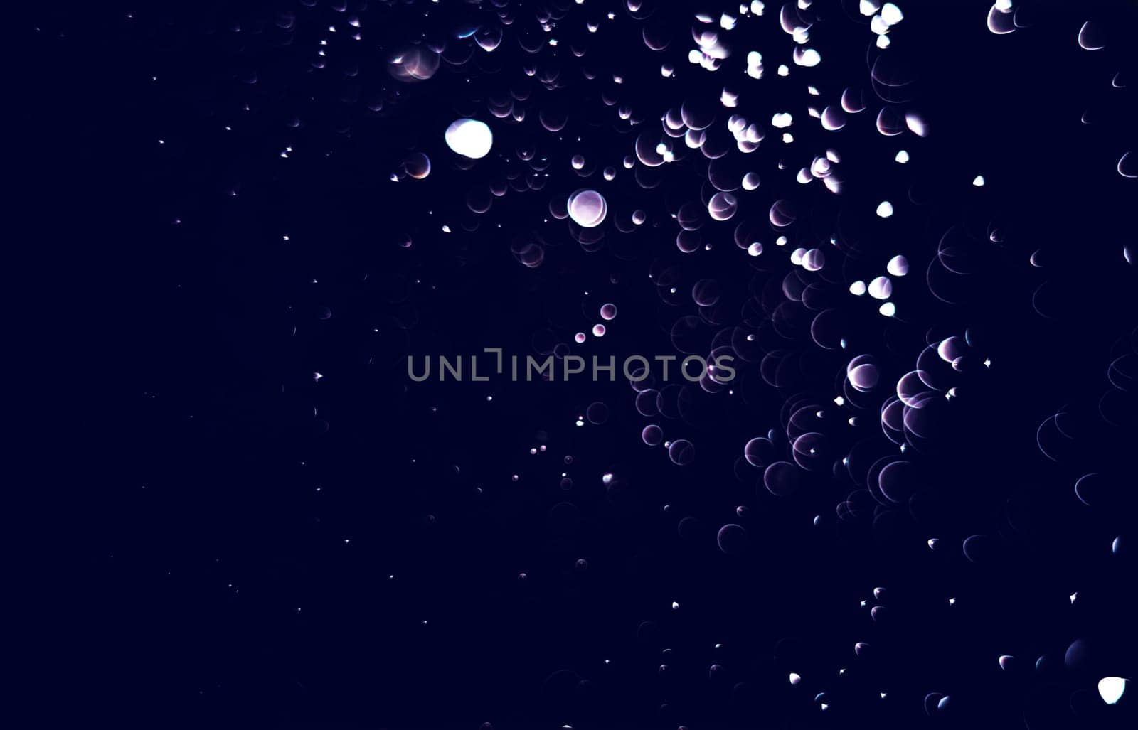 Light abstract dark bokeh christmas circle color glitter blurred black background