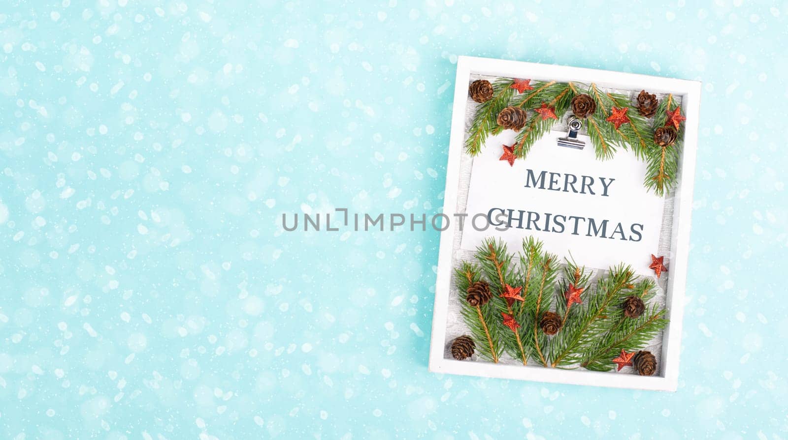 Christmas holiday background, frame with fir branches, stars, candy cane and pine cones, winter season greeting card