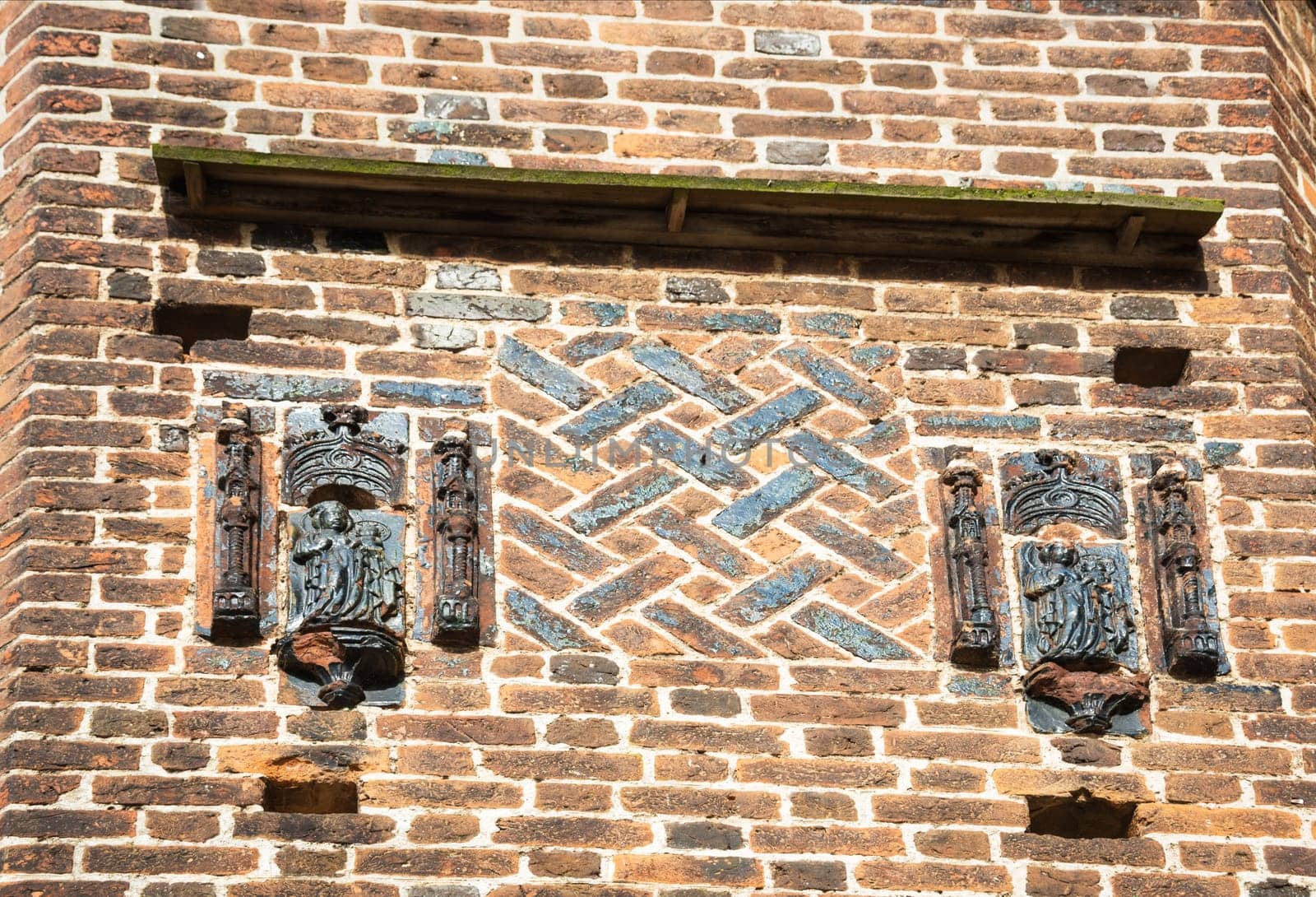 Ornamental tiles at the brick wall of a church at wismar
