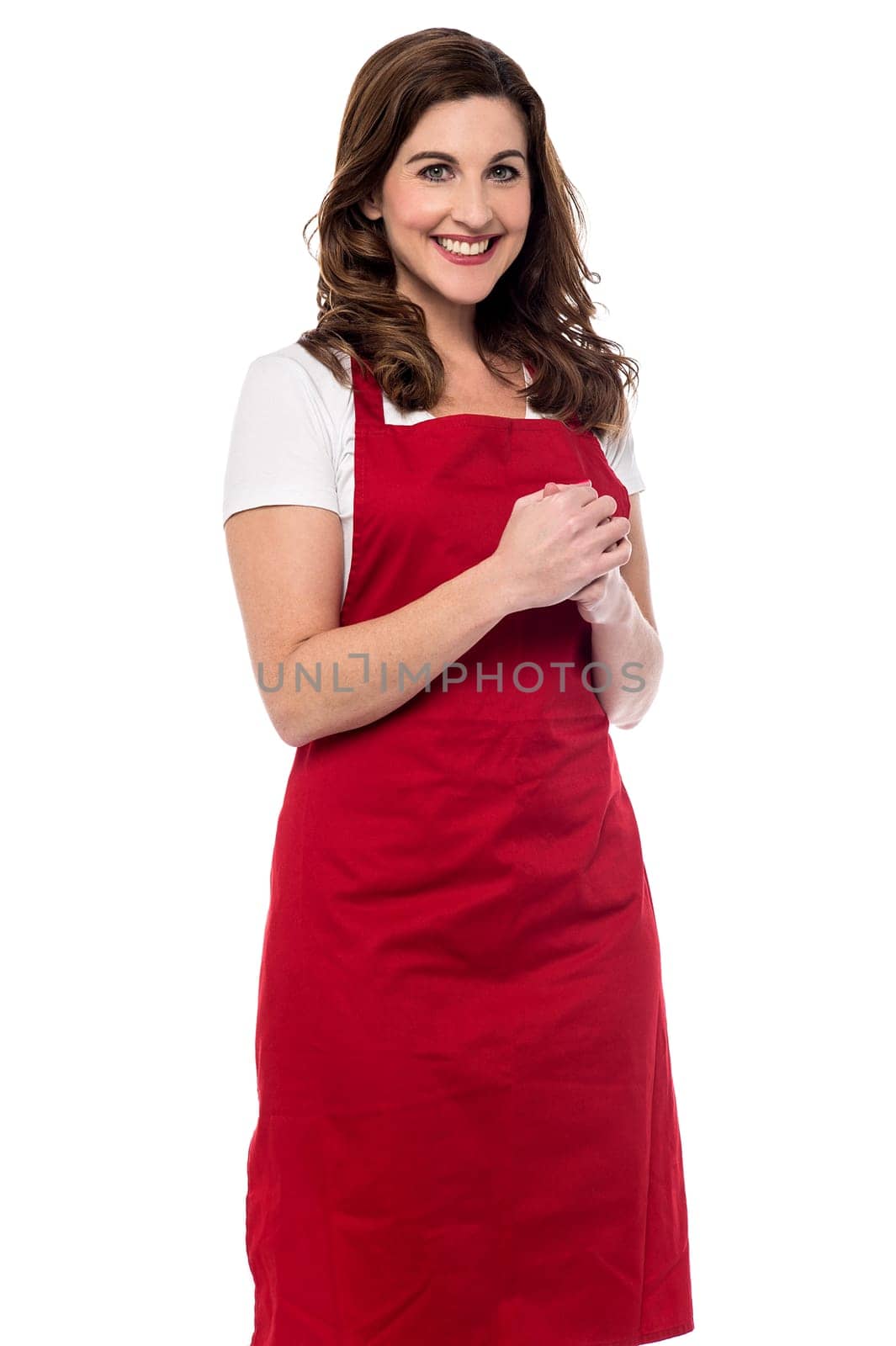 Happy female chef with clasped hands