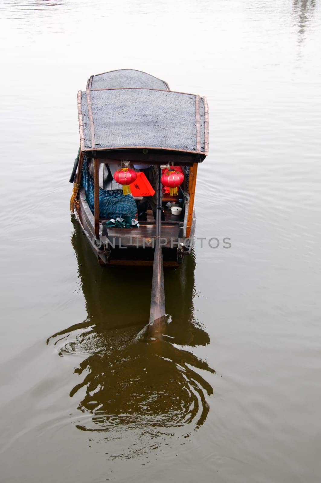 The view of water town in China, with boat man rowing on river