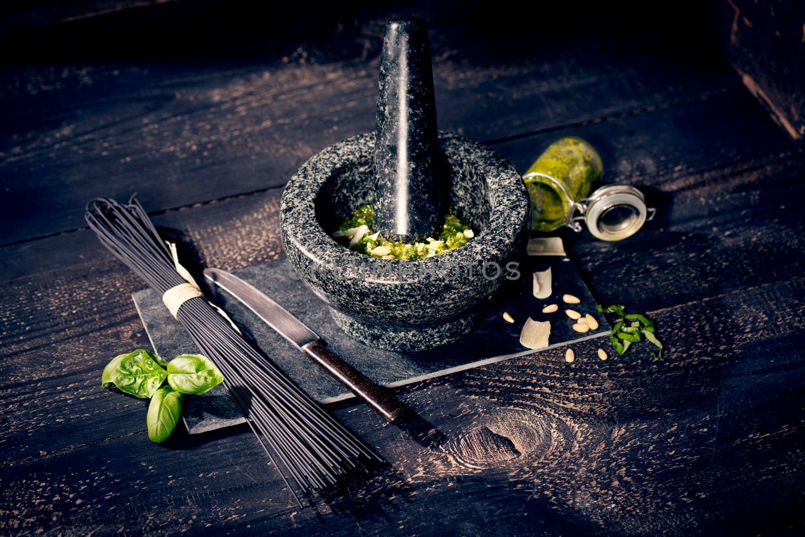 black spaghetti and pesto alla genovese,pesto with basil,garlic,parmesan,pine nuts and olive oil