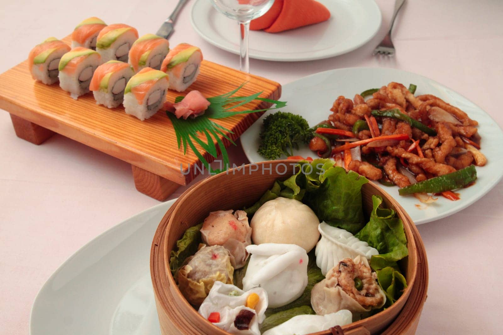 wontons in wooden bowl with sticks