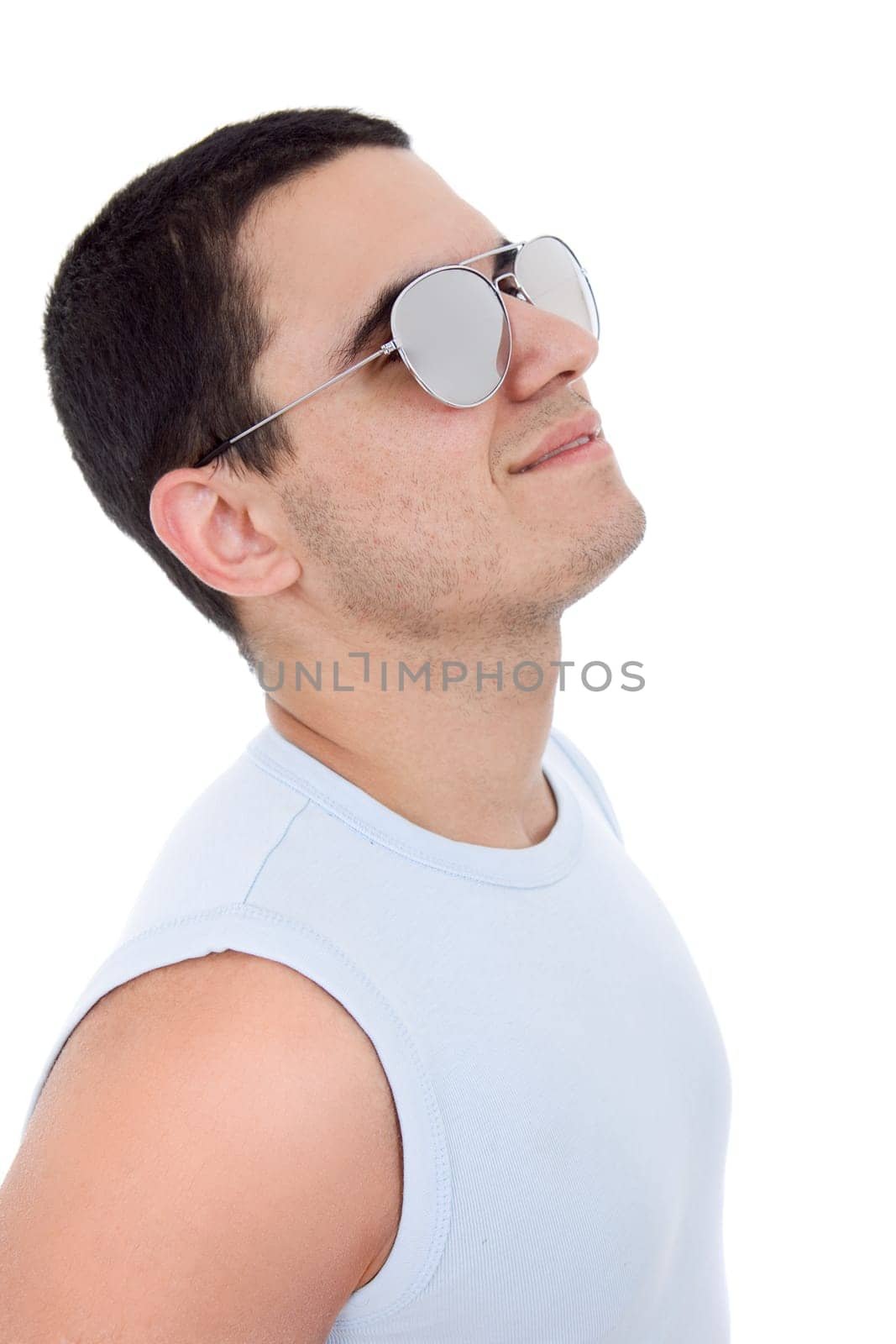 young casual man with sunglasses looking up, isolated