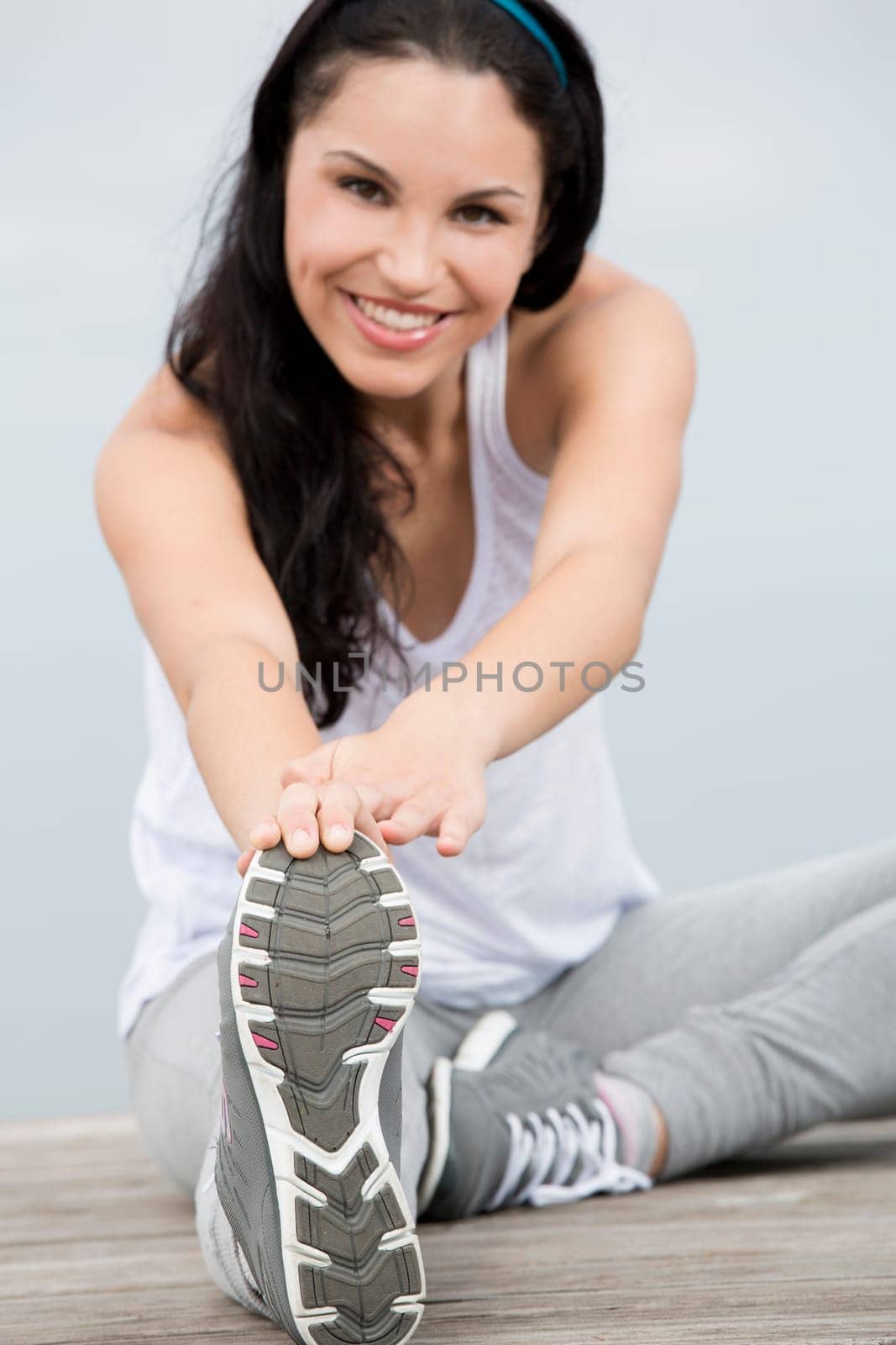 Beautiful young woman in outdoor doing yoga