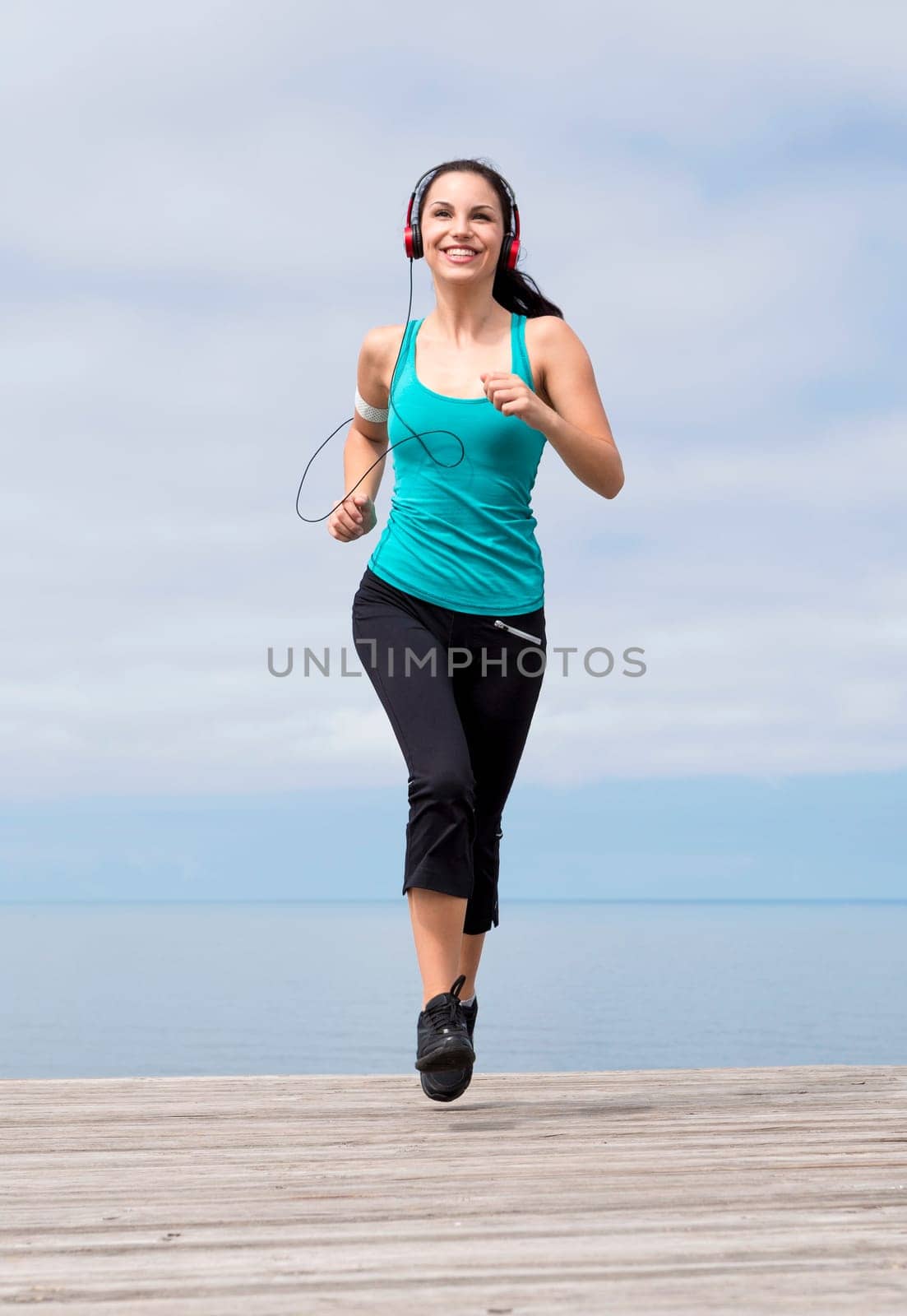 Beautiful young woman in outdoor doing yoga