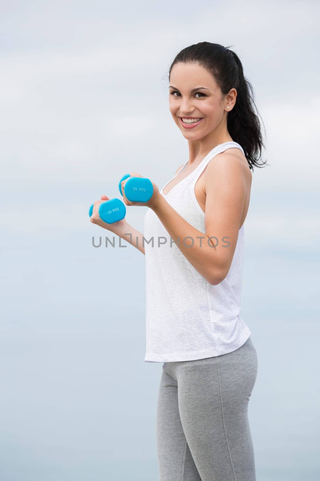 Beautiful young woman in outdoor doing yoga