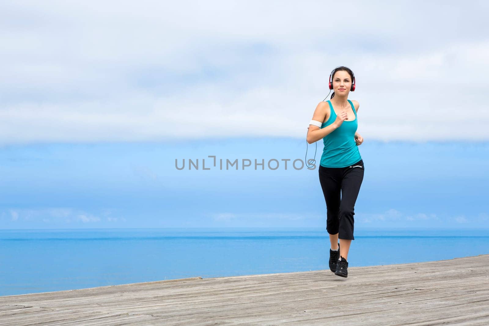 Beautiful young woman in outdoor doing yoga