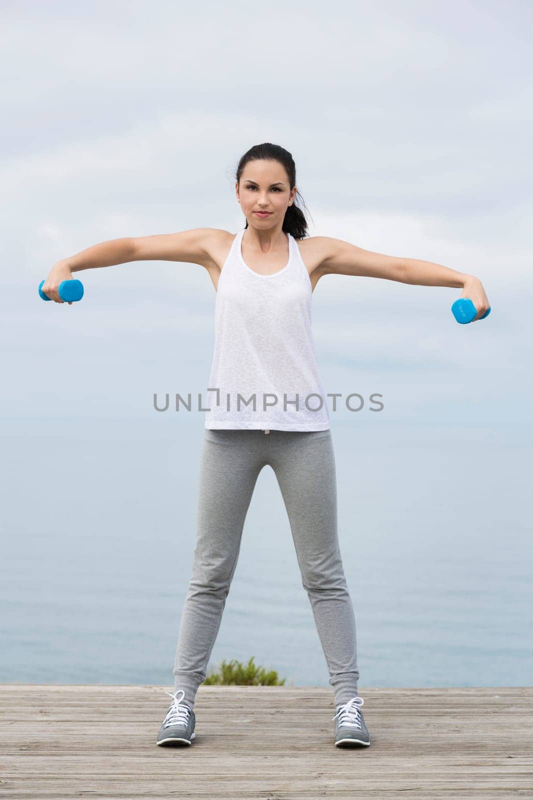 Beautiful young woman in outdoor doing yoga